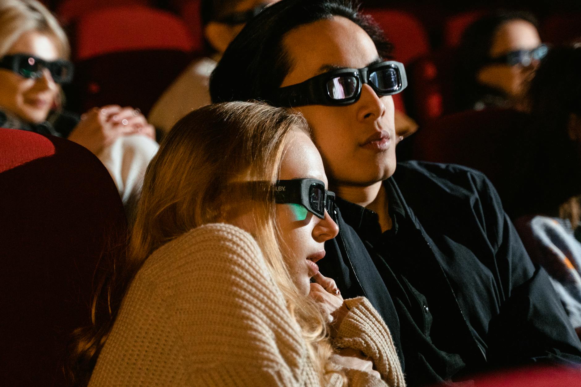 Movie reel with popcorn and a remote control, symbolizing summer blockbusters streaming.